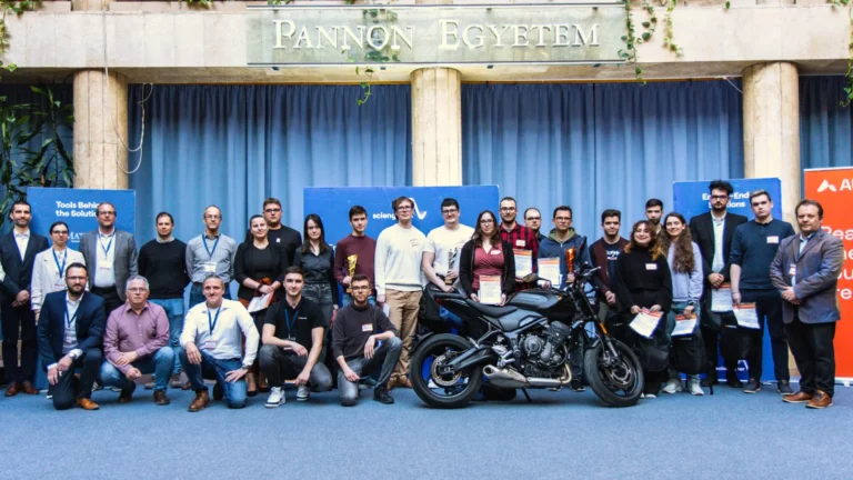 Winner student teams at the 2026 DATA-ENG Hackathon standing behind a motorbike, holding certificates after successfully completing the engineering challenge.